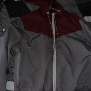 Gray and burgundy windbreaker